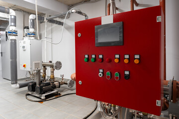 Poster - Control panel and equipment in a mechanical room focused on heating and water management systems