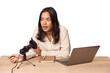 © Asier - Filipino woman podcasting with mic and laptop