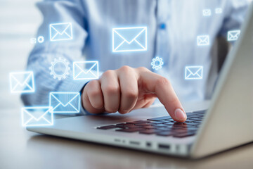 Aufkleber - A person interacting with a laptop and holographic email icons on a bright background.