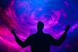 © Nalinthip - A man is standing in front of a purple and blue swirl