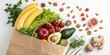 © Theerawat - A paper bag brimming with fresh produce and healthy nuts, a vibrant display of nutritious ingredients