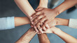 © Number One Studio - Hands of diverse individuals stacked together, symbolizing unity and teamwork, showcasing collaboration and support in professional or community setting