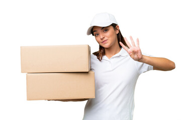 Wall Mural - Delivery caucasian woman holding boxes isolated on green chroma background happy and counting four with fingers