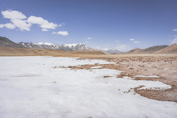 Wall Mural - High-mountain landscape panorama in length with snow and mountains in the Pamirs in Tajikistan, desert mountains without vegetation with rocks and glaciers