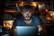 © Pinklife - An intense study session is portrayed with a bearded man focused on his laptop, illuminated by soft light, encapsulating the determination and effort behind mastering skills.