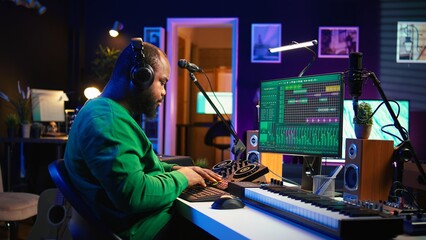 Aufkleber - Confident music engineer working on mixing console in home studio, producing new sounds for a song and editing volume levels in daw software. Audio technician recording acoustic files. Camera B.