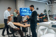 © standret - Conception of cooperation and communication. People are in the office by the 3d printer