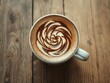 © intothestar - Intricate rosetta latte art in coffee cup, rustic wood background, morning, coffee break