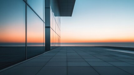 Poster - A modern architectural space with a sleek design overlooking a serene horizon at sunset.