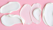 © Ethan Blake Archive - Swatches of cosmetic cream on a pink background, highlighting smooth textures and skincare product consistency. Generative AI