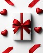 © Arnon  Parnnao - A beautifully wrapped gift box with a red ribbon and hearts, perfect for special occasions.