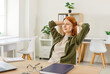 © Studio Romantic - Portrait of a happy Caucasian woman resting and relaxing during online work at home, leaning back in a chair. Calm and tranquility, enjoyable moment as she manages remote work in home office.
