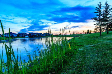 Wall Mural - a serene lake with a beautiful sunset in the background