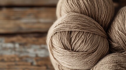 Wall Mural - Close-up of beige yarn skeins on wooden surface