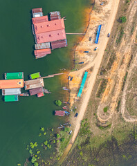 Wall Mural - The way of life of the villagers along Doi Tao Lake. A bird's eye view of the village along the lake. Rafts scattered on the calm water are both restaurants and houses welcoming tourists.