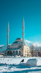 Ramadan or Islamic background photo: Alkazan Mosque with snowy landscap