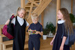© Tatiana Timofeeva/Stocksy - Classic school moments: kids in uniform getting ready for the day