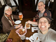 © tessy morelli/Stocksy - UGC POV family selfie pub food