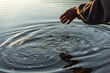 © Ivan Andrianov/Stocksy - Meditative Touching the Cold Water's Surface