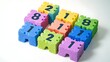 © TANVEER - A set of colorful foam number tiles forming a playful learning space