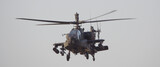 ah-64 apache military helicopter in action