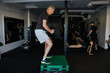 © Rob and Julia Campbell/Stocksy - Group Fitness Session With Diverse Participants Exercising Together