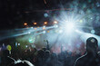 © Alexey Tkachenko  - Rock festival and orchestra in the light of spotlights and spotlights on stage. Fans rejoice