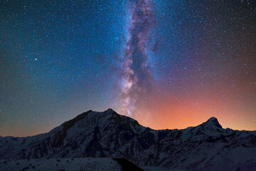 Wall Mural - Beautiful bright milky way galaxy under the mountains. Night landscape.
