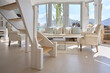 © Rowena Naylor/Stocksy - Cozy modern living room with natural light and mountain view
