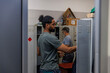 © Jovo Jovanovic/Stocksy - Male engineer opening locker in industry