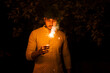 © Evgeniia Siiankovskaia/Stocksy - Portrait of Indian man with sparkle at Diwali night.
