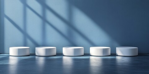 Poster - Circular white stools arranged in a minimalist interior with blue walls and natural light at midday