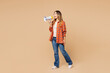 © ViDi Studio - Full body young woman she wears orange shirt casual clothes hold in hand megaphone scream announces discounts sale Hurry up isolated on plain pastel light beige background studio. Lifestyle concept.