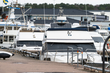 Wall Mural - Row of cabin cruisers at a pier.