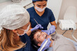 © VICTOR TORRES/Stocksy - Dental professionals providing patient care at a clinic