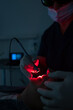 © VICTOR TORRES/Stocksy - Dentist performs advanced dental procedure with laser tool