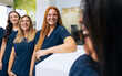 © VICTOR TORRES/Stocksy - Team of Smiling Dental Professionals in Clinic Setting