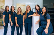 © VICTOR TORRES/Stocksy - Professional Dental Team at a Modern Clinic
