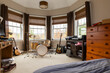 © Raymond Forbes LLC/Stocksy - Drum set and guitar in child home bedroom decor