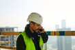 © Ivan Jovanovic/Stocksy - Civil engineer talks on the phone