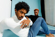 © valbar STUDIO/Stocksy - Two men posing in stylish casual clothing