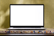 © Jakub and Jedrzej Krzyszkowski/Stocksy - Laptop Mockup With White Screen On Terrazzo Stand