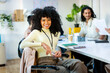 © Jimena Roquero/Stocksy - Portrait of young businesswoman in office looking at camera