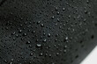 © Marco Maradei/Stocksy - Water resistant black fabric