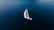 © Milan Jakic/Stocksy - Soolitary White Sailboat on Calm Blue Sea
