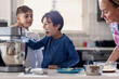 © Nasos Zovoilis/Stocksy - Excited Kids Taste Dessert Batter While Baking