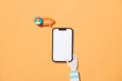 © Marc Tran/Stocksy - Creative Concept of Smartphone with Chat Bubble on Orange Background