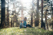 © Santi Nuñez/Stocksy - Family enjoying nature in a sunlit forest
