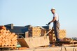 © Serhii - Construction worker in uniform and safety equipment have job on building. Industrial theme