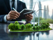 © zphoto83 - Business professional evaluating renewable energy project with wind turbines and greenery in urban setting